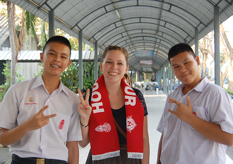 An English teacher with students in Thailand.