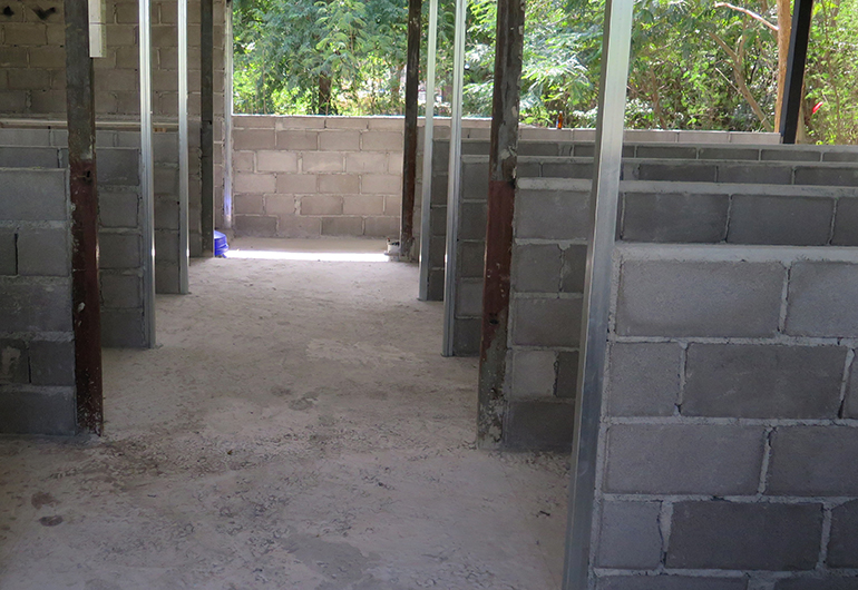 The new cement floor of a kennel in Thailand.