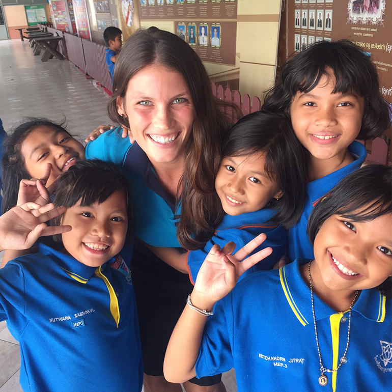 A teacher with kids in Thailand.