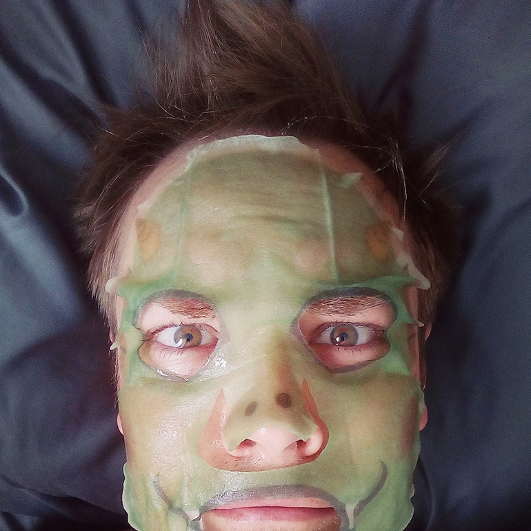 Chase wearing a dragon face mask from Korea.