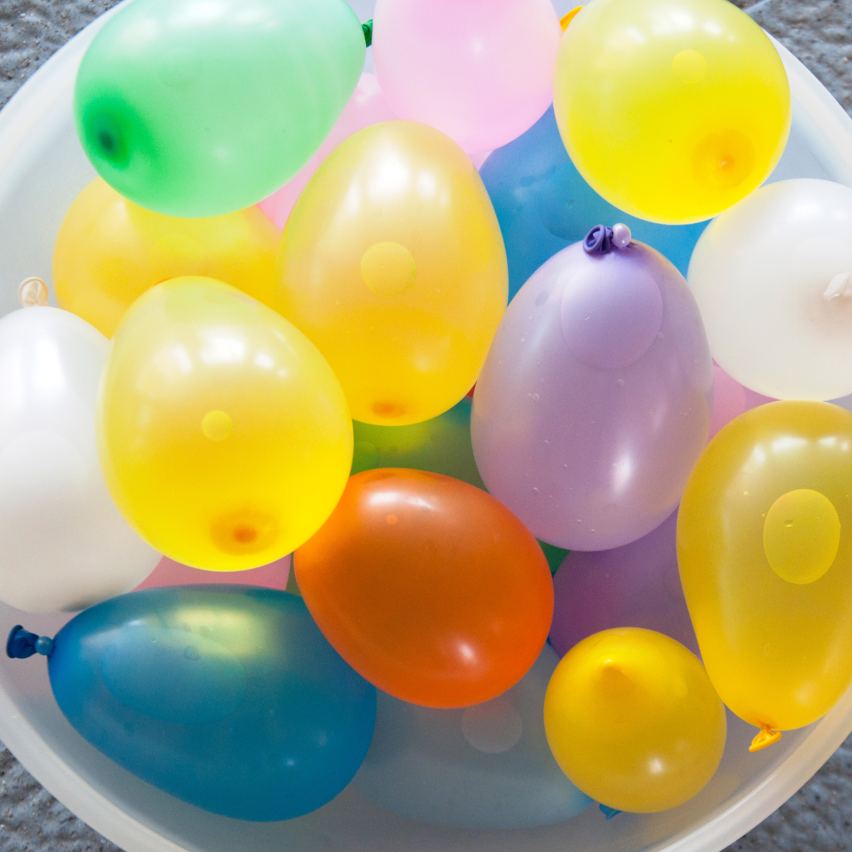 A bucket full of water balloons.