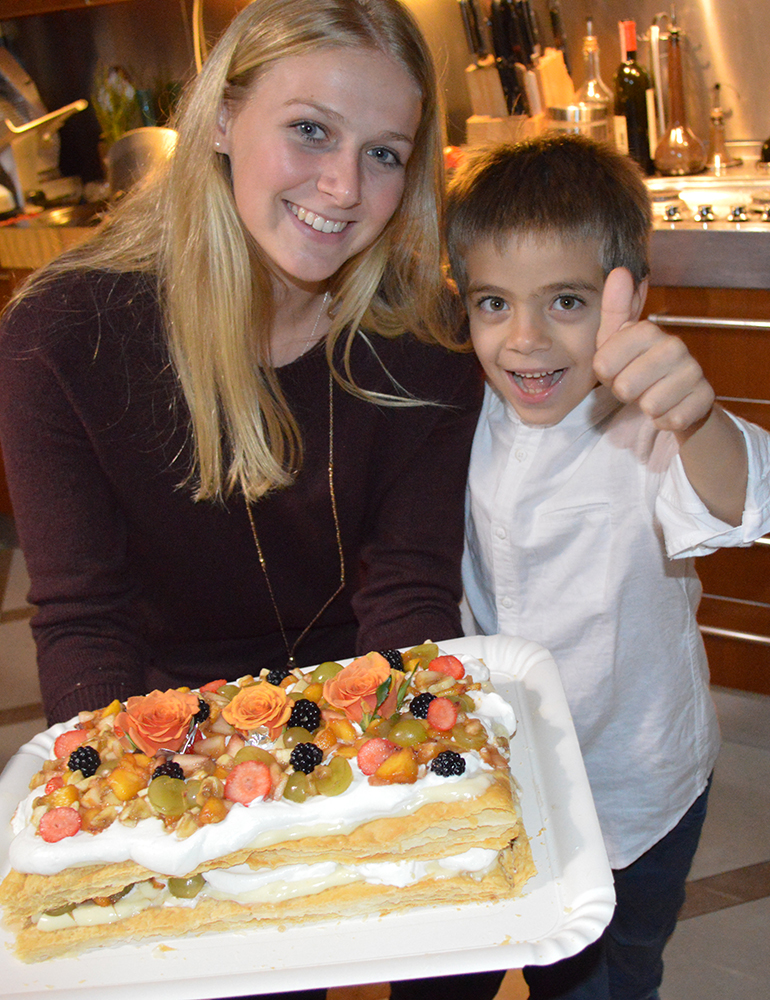 Greenheart Traveler, Bethany Carideo, holding her birthday cake in Italy.