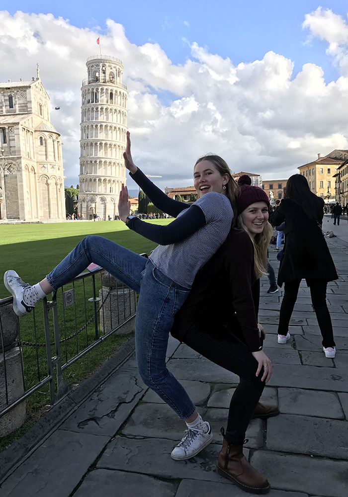 Two friends posing in Pisa