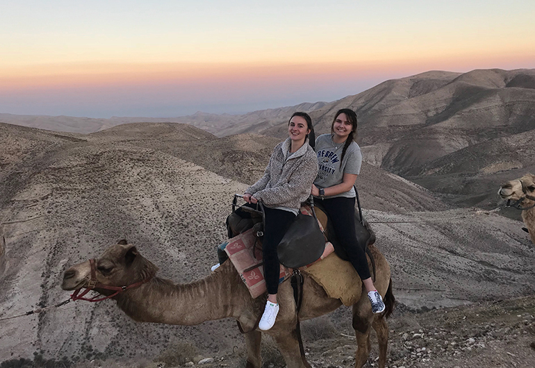 Girls on a camel in Israel
