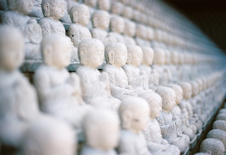  A row of Buddha sculptures line the Self Realization Fellowship temple in Encinitas, California.