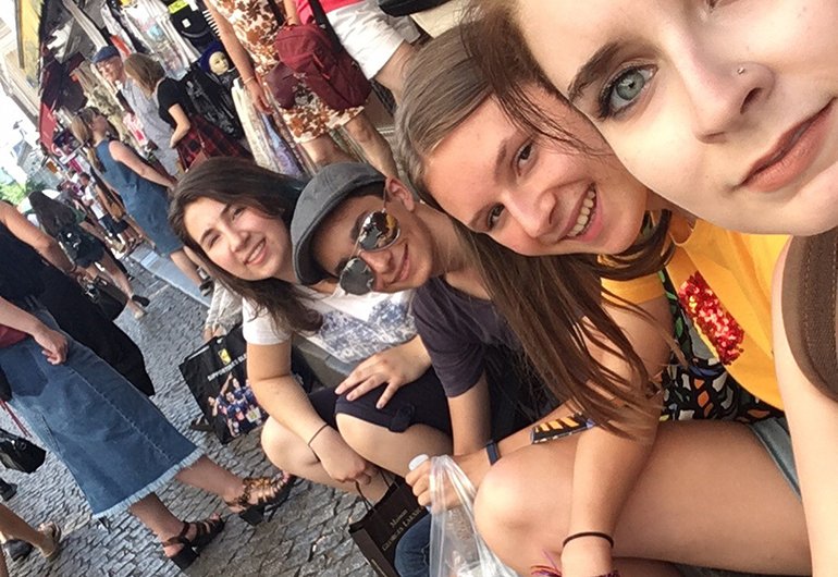 Noam and friends taking a selfie in the streets of Paris, France.