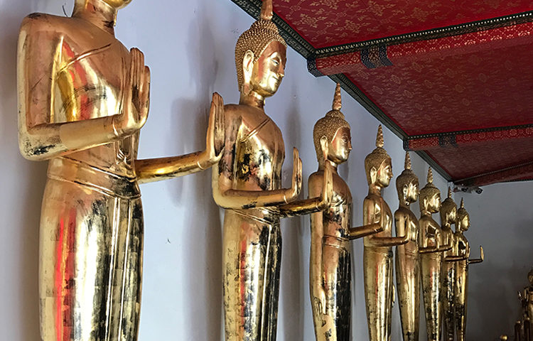 Beautiful golden statues of Buddha in Thailand.