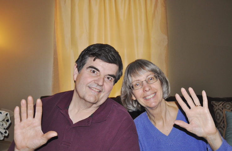 Chase's parents waving to greet his students.