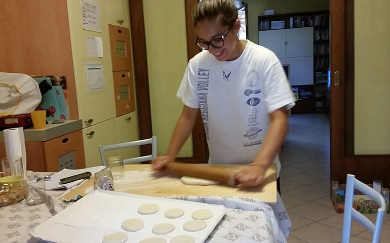 Rolling and cutting dough in Italy.