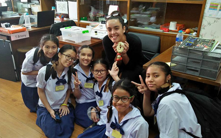 Greenheart Traveler, Carolina Azcuna, with students in Thailand.