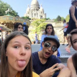 A group photo in front of the Sacre Coeur in Paris, France.