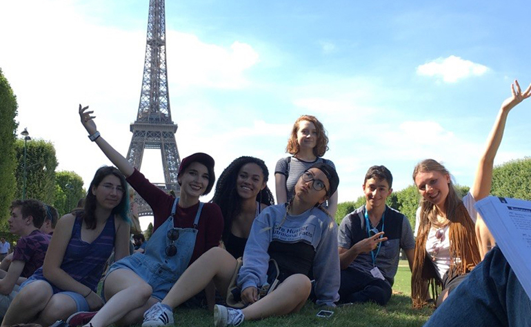 Noam's new friends in front of the Eiffel Tower.