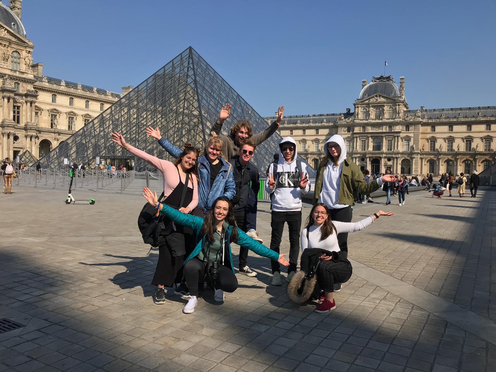 High School Abroad Students in Paris in front of the Louvre Museum.